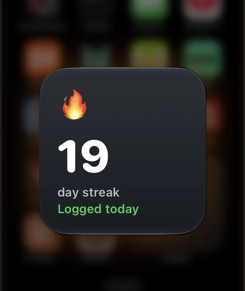 iPhone Home Screen with the Liftspan streak widget showing the daily flame